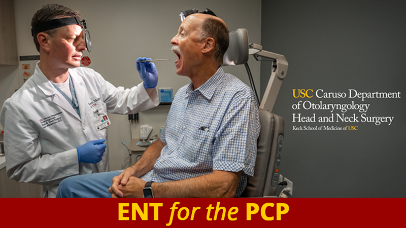 A patient sitting in the exam chair with his mouth open examined by a physician. ENT for the PCP. USC Caruso Department of Otolaryngology - Head and Neck Surgery.