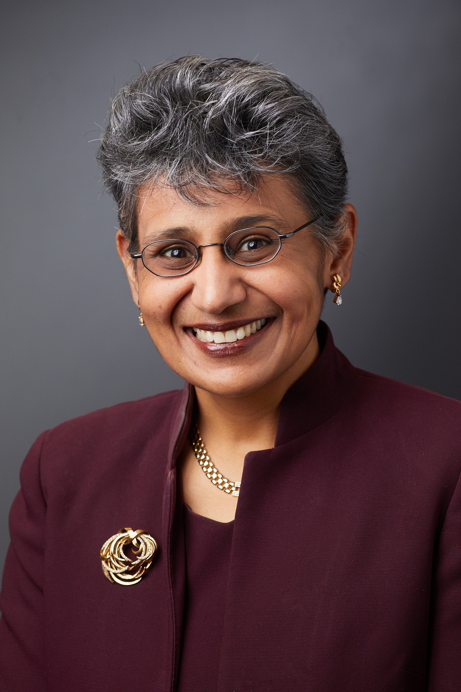 Woman in a burgundy suit