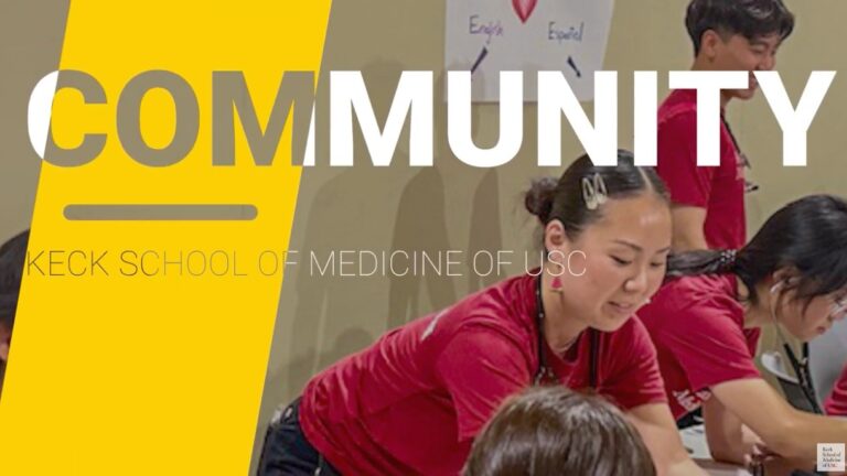 woman leaning on a table talking to children