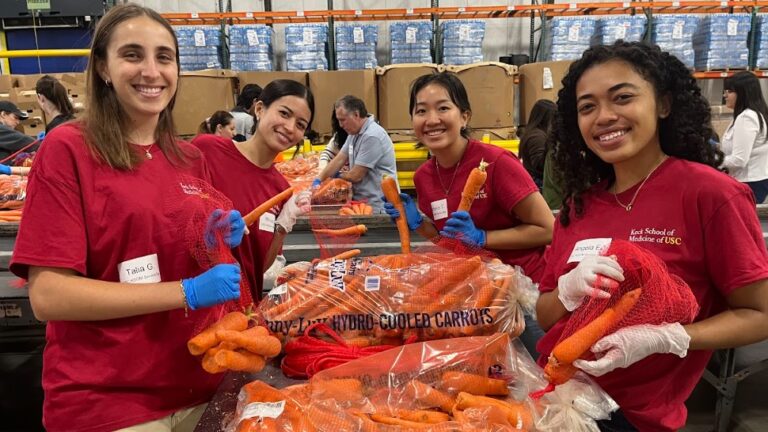 Phot0 shows Keck School of Medicine volunteers getting food ready for distribution to the community.