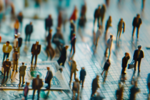 An image of people walking around over money.