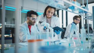 Two scientists working in a lab.