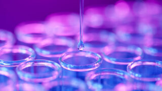 Test tube with pipette dripping down.