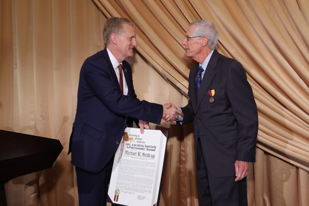 Dr. Michael Stallcup receives a lifetime achievement award on 4/11/23