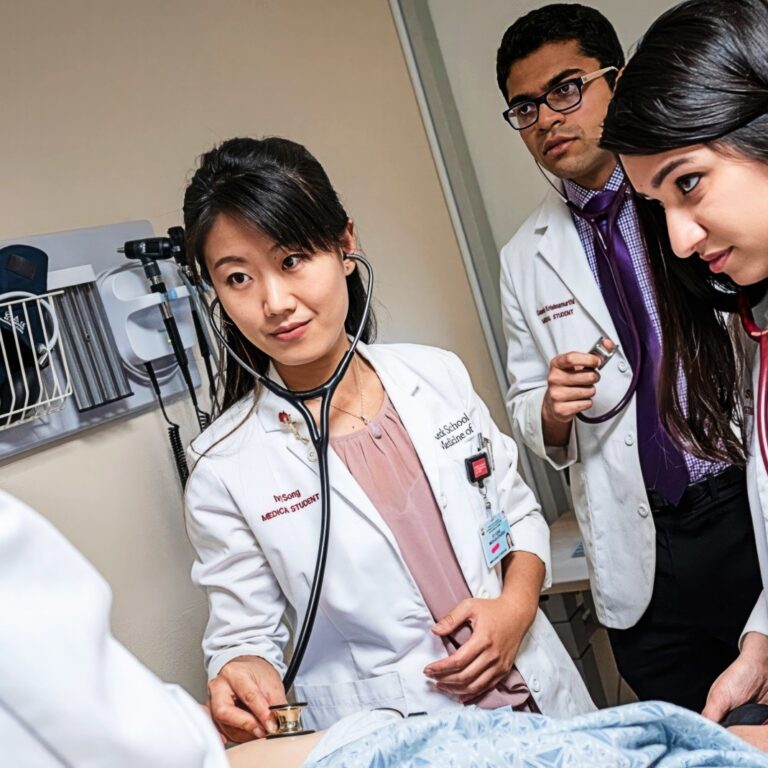 Keck physicians meet with a patient