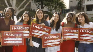 KSOM students displaying their Match Day signs