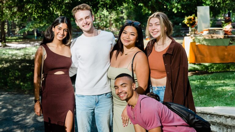 smiling students in a courtyard