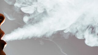 Person exhanlign smoke