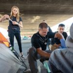 Brett Feldman, Eddie Menacho and Gabrielle Johnson work as part of the Street Medicine team at USC, which provides medical care to people who are living on the streets. (Photo/Chris Shinn)