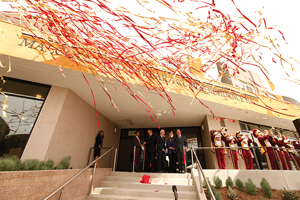 Confetti streamers fly during a ribbon-cutting ceremony for the Malcolm and Barbara Currie Residence Hall opening, held Aug. 25 on the Health Sciences Campus.