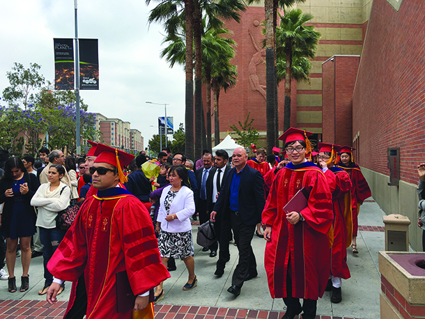 Keck School of Medicine of USC PhD graduates walk out of the Galen Center after the commencement ceremony on May 14, 2016.