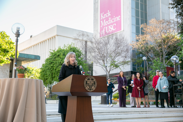Karen Restifo speaks to the gathered crowd before Match Day celebrations begin