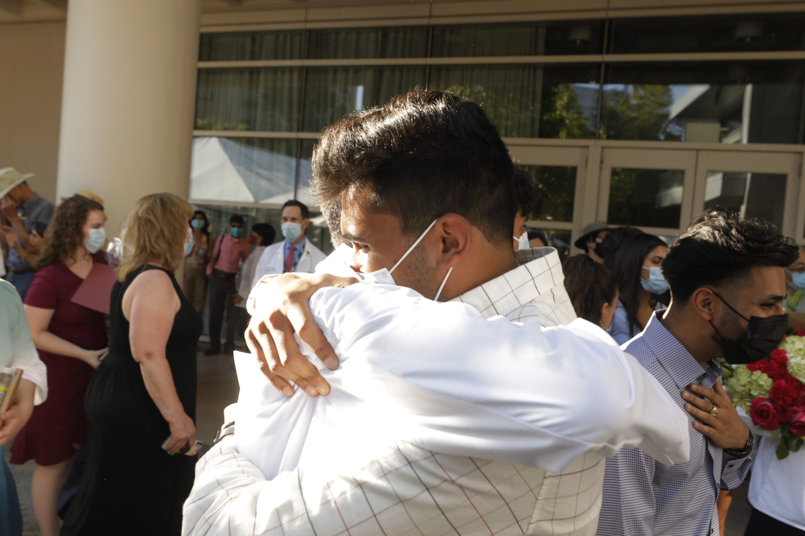 Students hug after the ceremony.