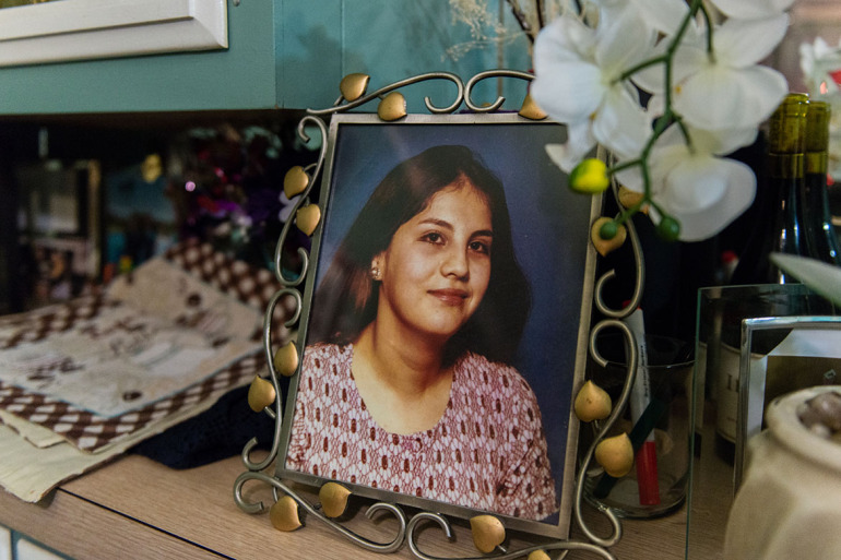 A photograph of Rosemary Navarro’s mother, Rosa Maria Navarro, sits on her dining room table. Navarro’s mother died in 2009 from Alzheimer’s disease. “What I went through with my mom I wouldn’t wish on anyone,” Navarro said. (Heidi de Marco/KHN)