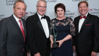 with the Visionary Award and Stephen B. Gruber, MD, PhD, MPH, director of the USC Norris Comprehensive Cancer Center.