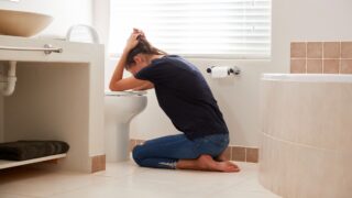 Woman Suffering With Morning Sickness