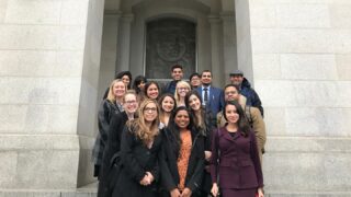 group of students in front of building
