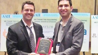 Adam Leventhal receiving award