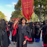 USC graduate giving Fight On sign