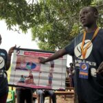 young person giving a presentation outside