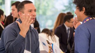 two people speak at career fair