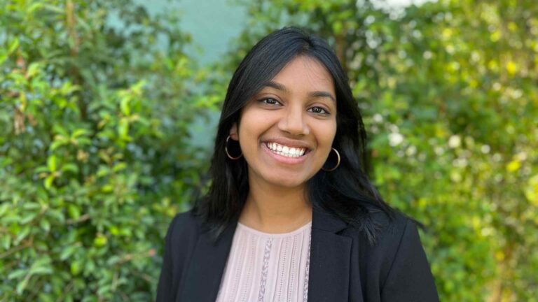 smiling woman in suit