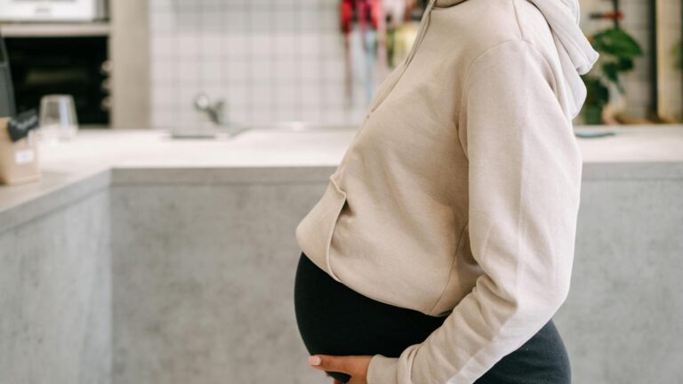 pregnant person in kitchen