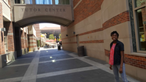 Charis Alexander standing in walkway at UPC campus