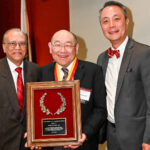 Dr. Paul Lee (center) receives the Narsing A. Rao, MD, Endowed Lecture Award from Drs. Narsing Rao (left) and J. Martin Heur (right).