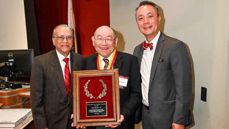 Dr. Paul Lee (center) receives the Narsing A. Rao, MD, Endowed Lecture Award from Drs. Narsing Rao (left) and J. Martin Heur (right).