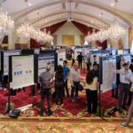 Image of attendees viewing posters at the event