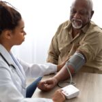 man getting blood pressure taken