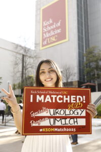 Priya Kohli poses with her match day sign in the quad