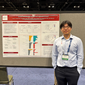researcher in front of scientific poster