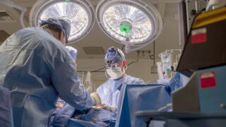 Vaughn Starnes performing a cardiovascular surgery.