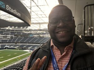 smiling man in sports arena