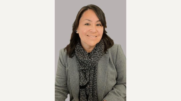 Headshot of Vivan Medina against a grey background