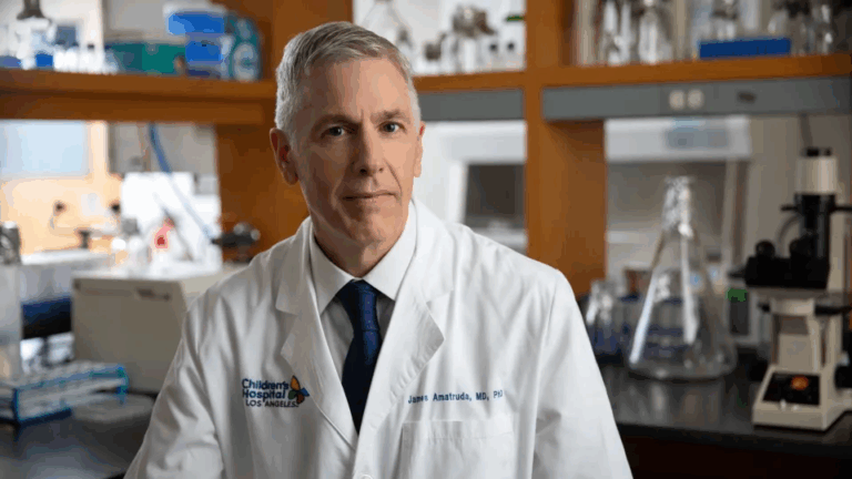 James F. Amatruda, MD, PhD, in a white coat in his lab