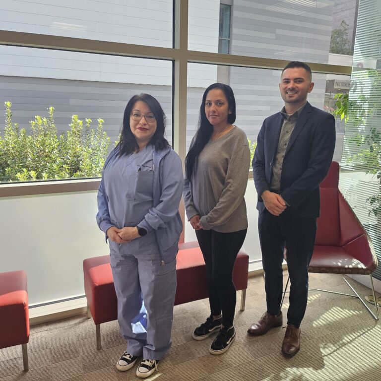Three members of our outpatient psychiatry team stand together in the lobby of our clinic.