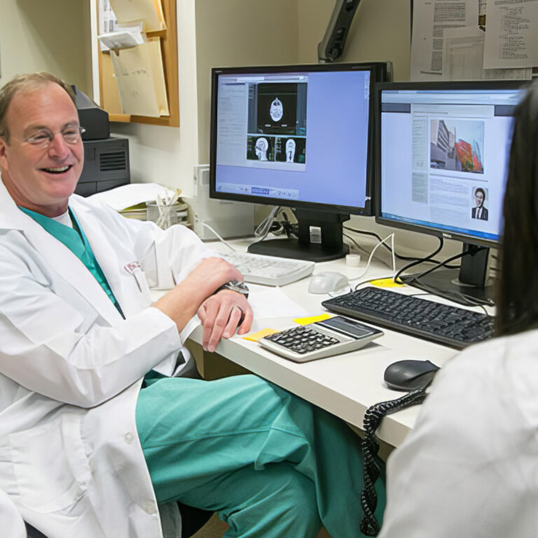 Resident in front of a computer screen