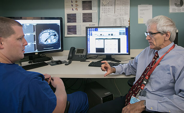 Doctor talking to fellow