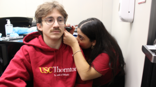 MS-SLP student conducting hearing screening at the USC Thornton School of Music.