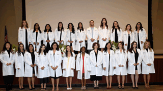May 2025 - Cohort 4 White Coat Ceremony at HSC Mayer Auditorium