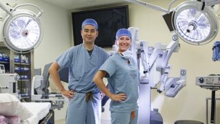 Two urologists standing in an operating room