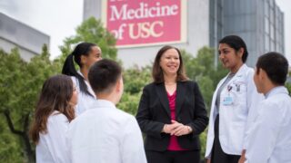 Dr. Donna Elliott speaks with students