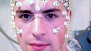 Man wearing EEG cap