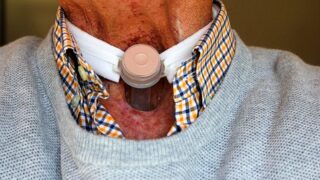 Man's throat with bandage