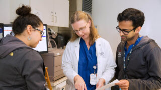 OBGYN physician speaking to Keck School staff.