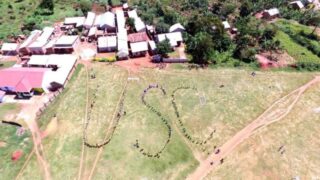 Overhead view of a lawn with U-S-C spelled out