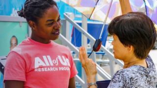Middle-aged woman talking to young girl
